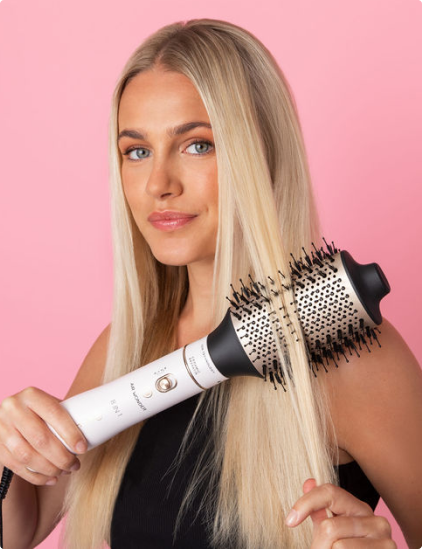 Woman using Bellissima hot brush on her hair