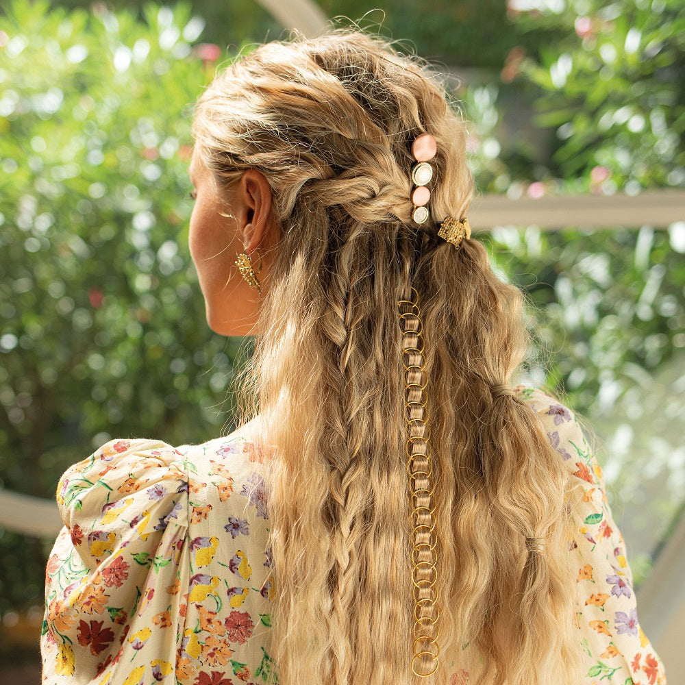 Back view of woman with styled hairstyle achieved with Bellissima beach wave styler