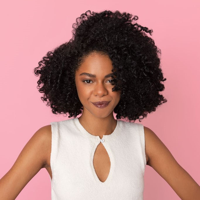 Woman with curly hair after using the diffuser