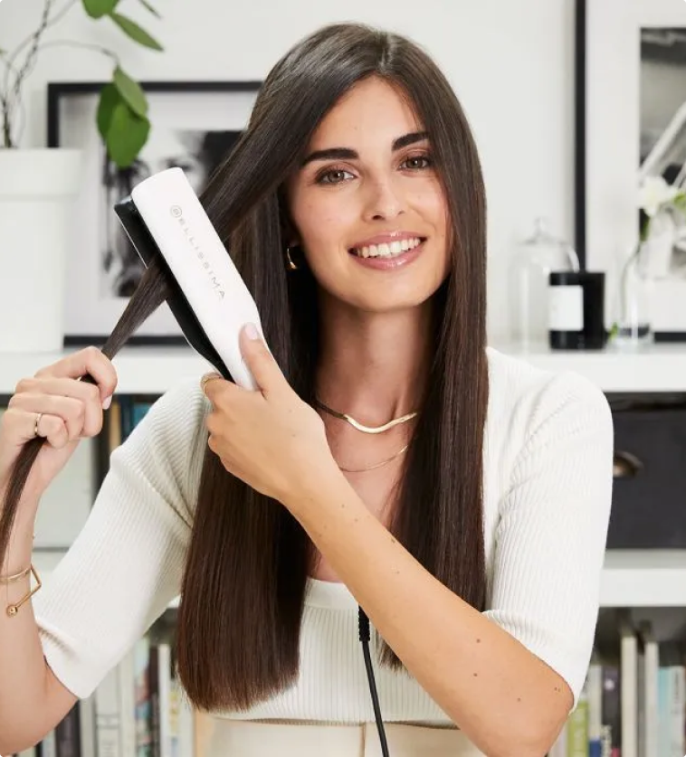 Woman straightening her hair using the Bellissima Steam Elixir Hair Straightener 