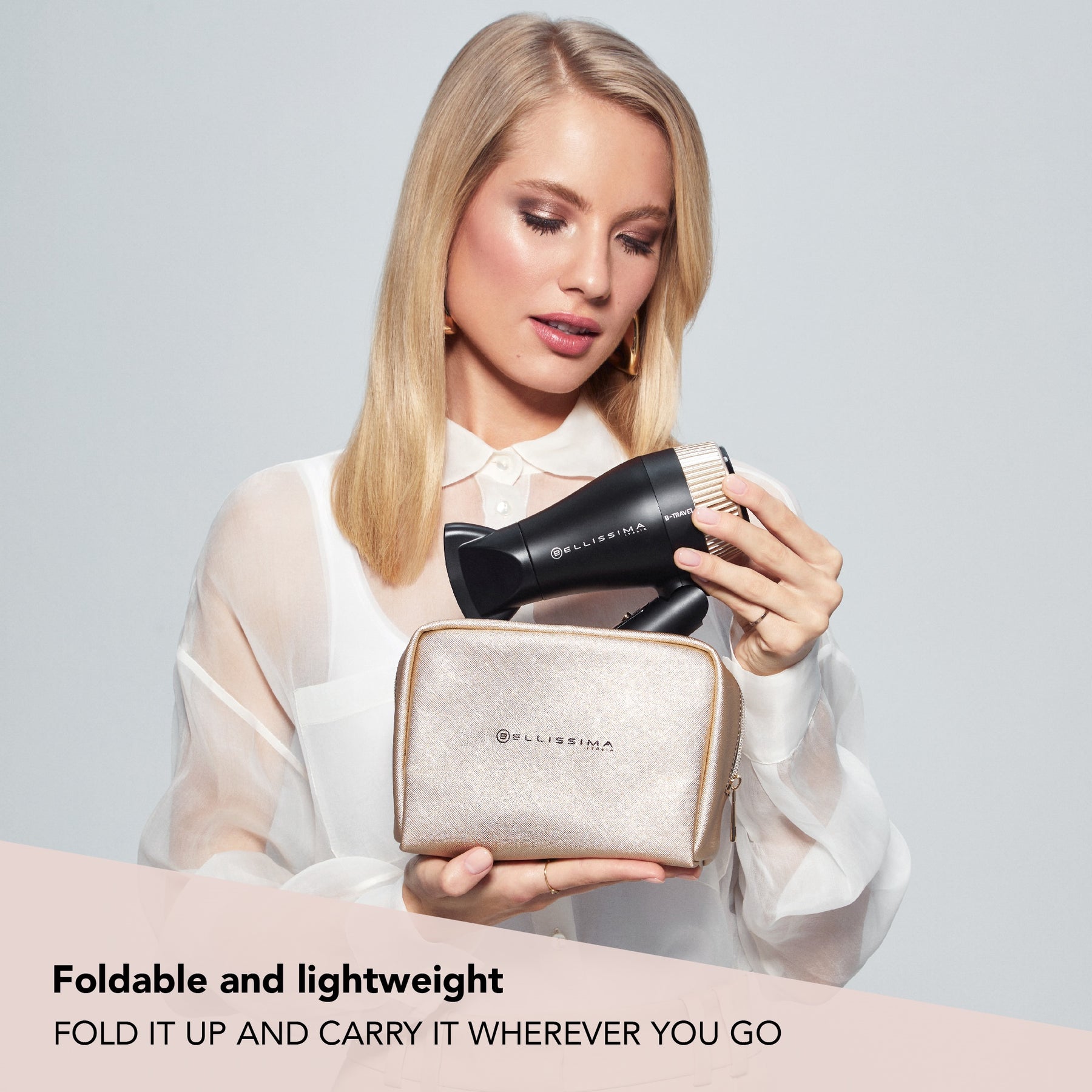 Bellissima Travel Hair Dryer being placed in a bag with foldable and lightweight caption