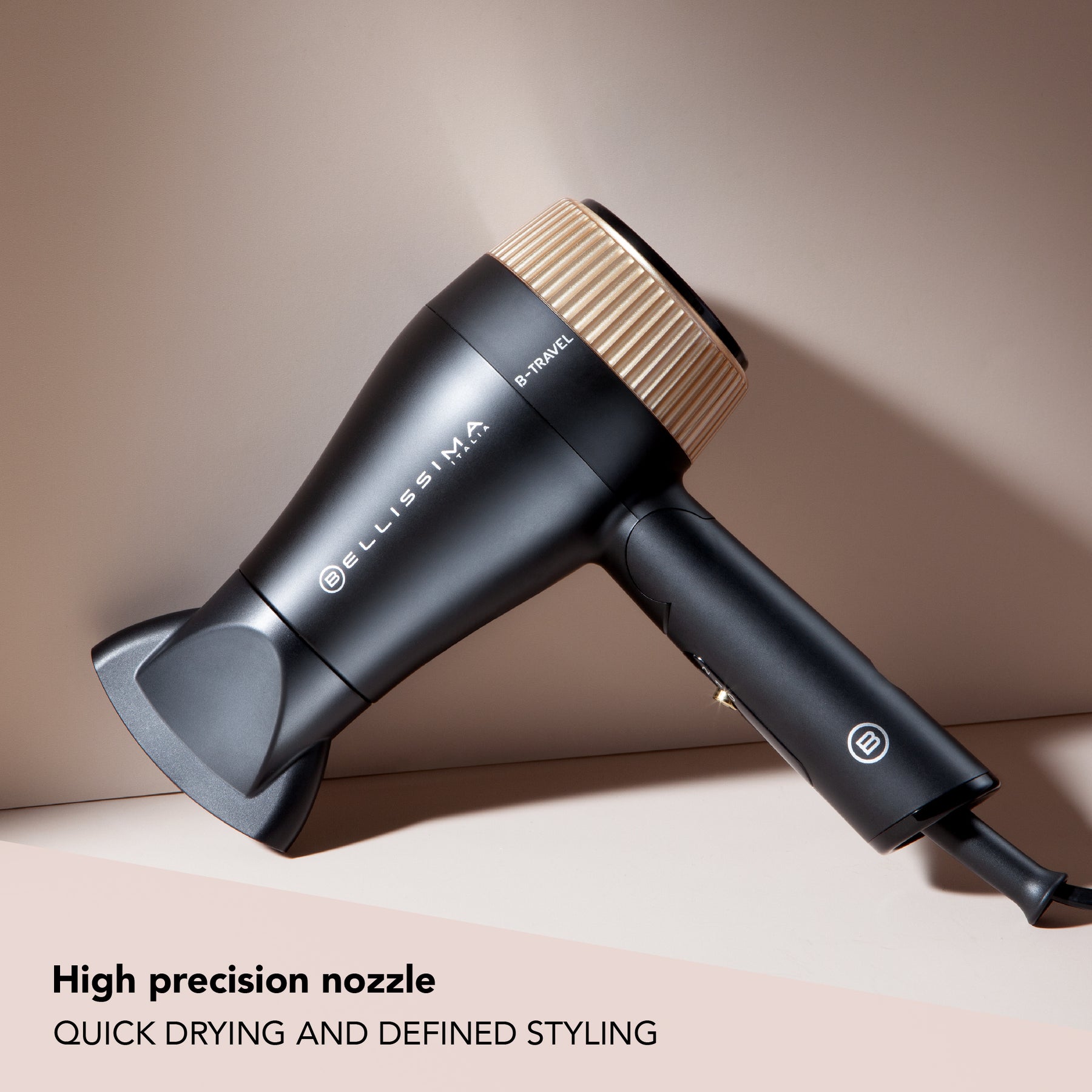 B-Travel Hair Dryer against a nude background with High Precision Nozzle caption