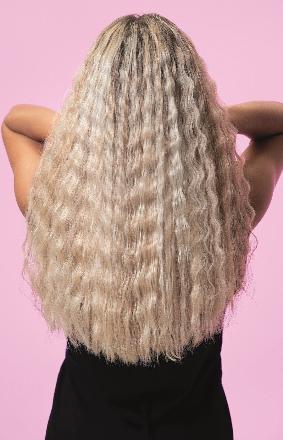 Back view of woman with tighter beach wavy hair
